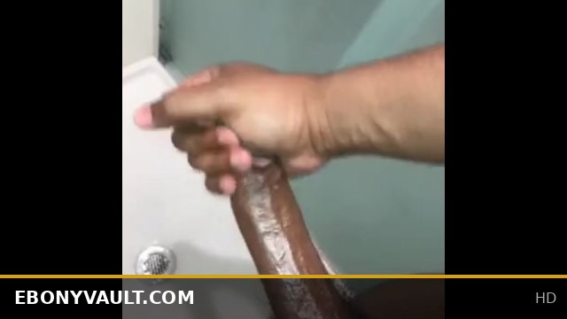 Stroking my big black dick while girlfriend  in room