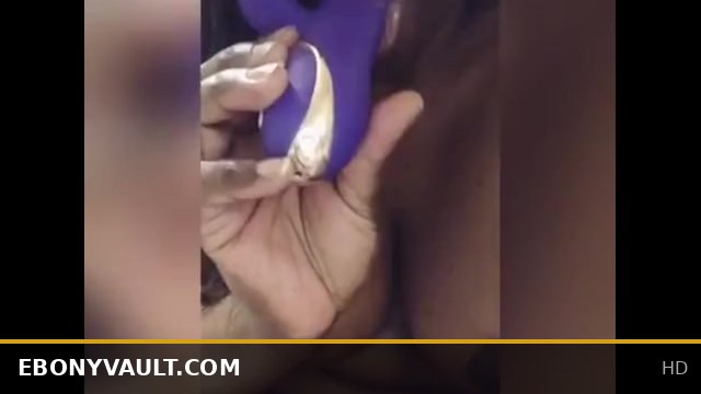 Ebony beauty enjoys licking and sucking delicious juices off a dildo